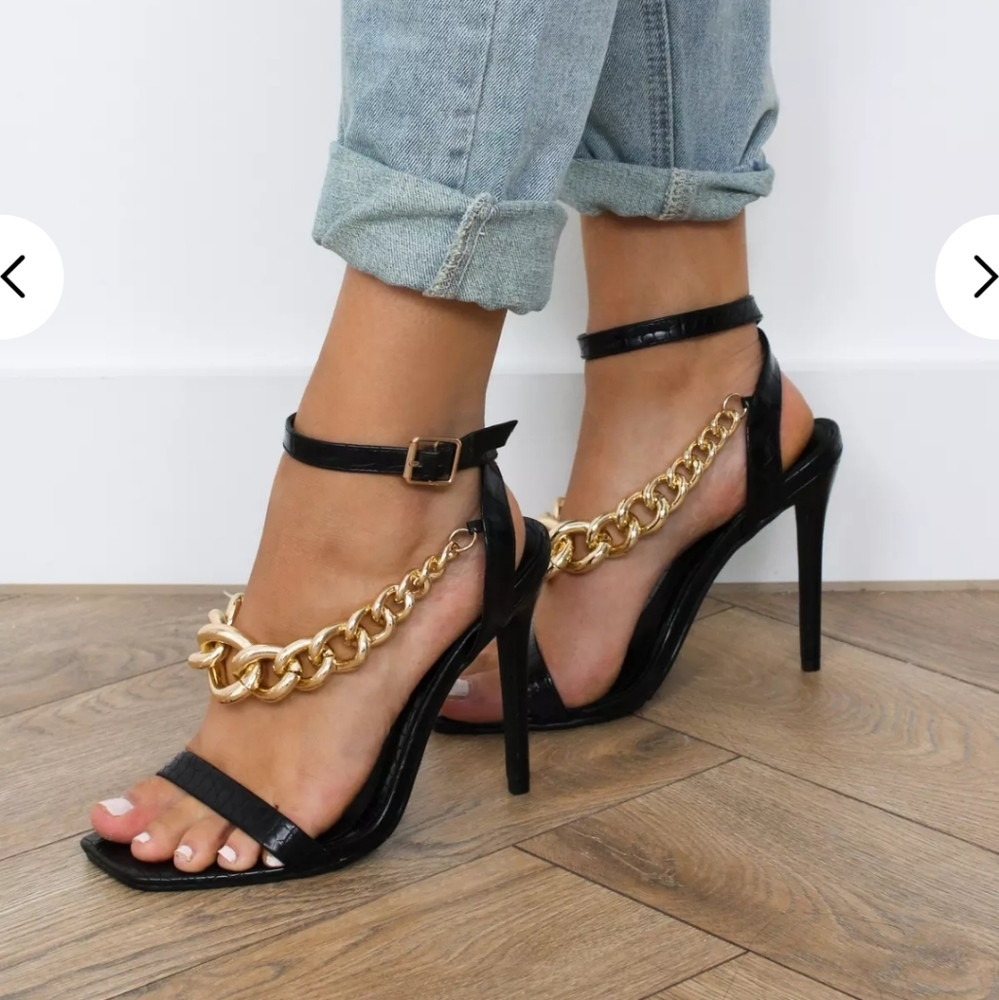 Black heels with chunky gold chain